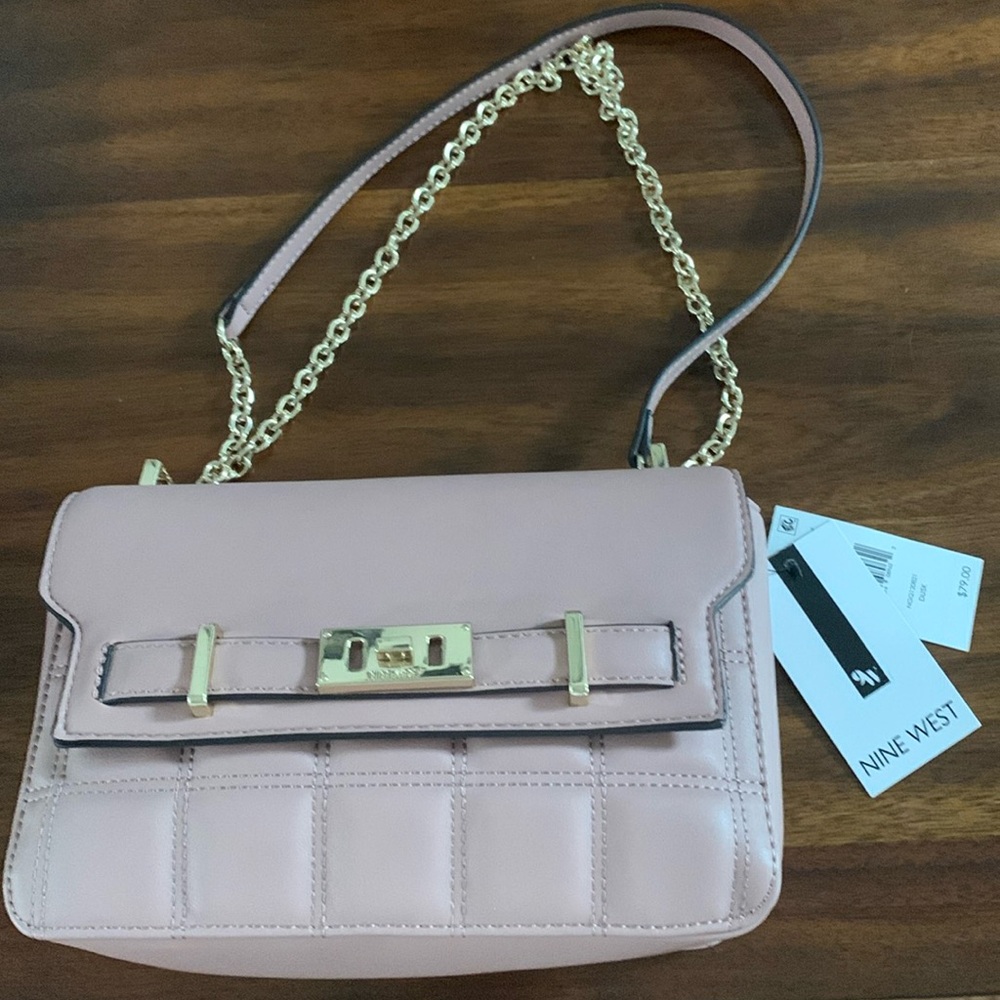 New with tags Nine West  Sadie in Dusty Rose. 10”x7”x3”.shoulder strap 20”drop.